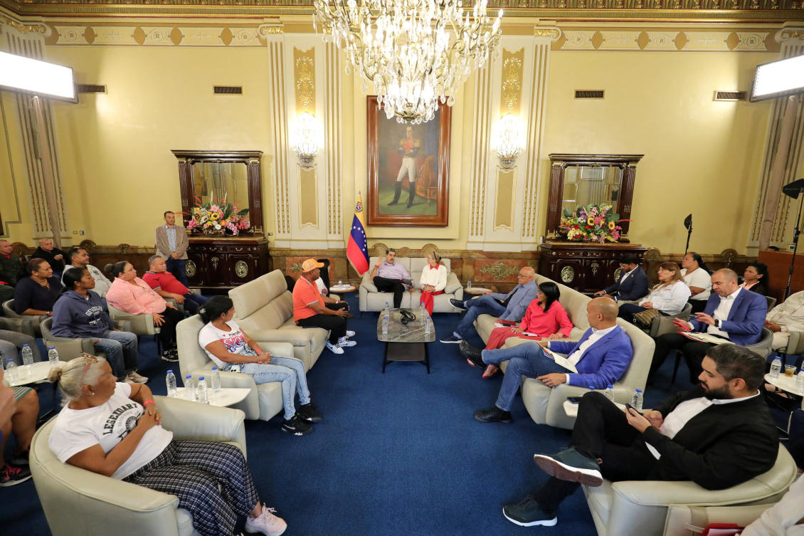 Venezuela President Nicolas Maduro and his wife Cilia Flores meet with family members of Venezuelans held in a high-security prison in El Salvador after being deported from the US on March 20, 2025. (Miraflores Palace via Reuters)