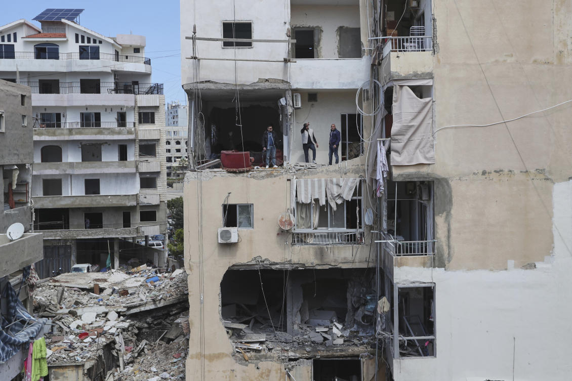Residents check the site of Saturday’s Israeli airstrike in the southern port city of Tyre, Lebanon, Sunday, March 23, 2025. (AP)