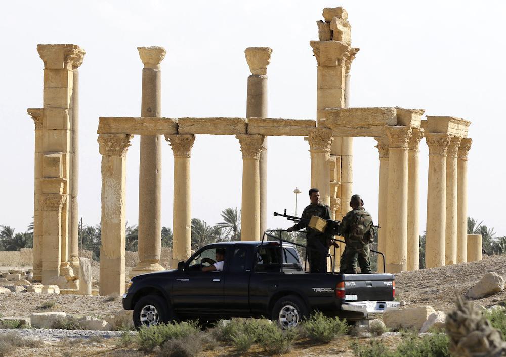 Above, army personnel patrol the ancient city of Palmyra, where some Syrian military bases are located, on May 6, 2016. (AFP file photo)
