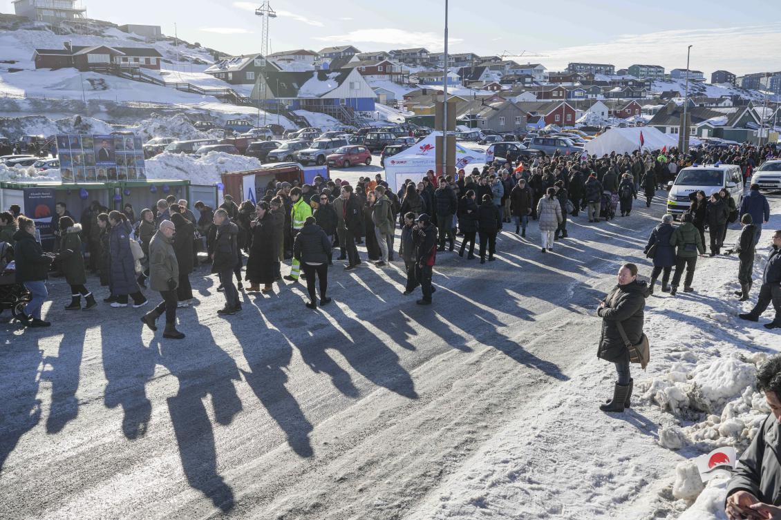 People stand in line outside a polling station to cast their vote in parliamentary elections, in Nuuk, Greenland, Mar. 11, 2025. (AP)