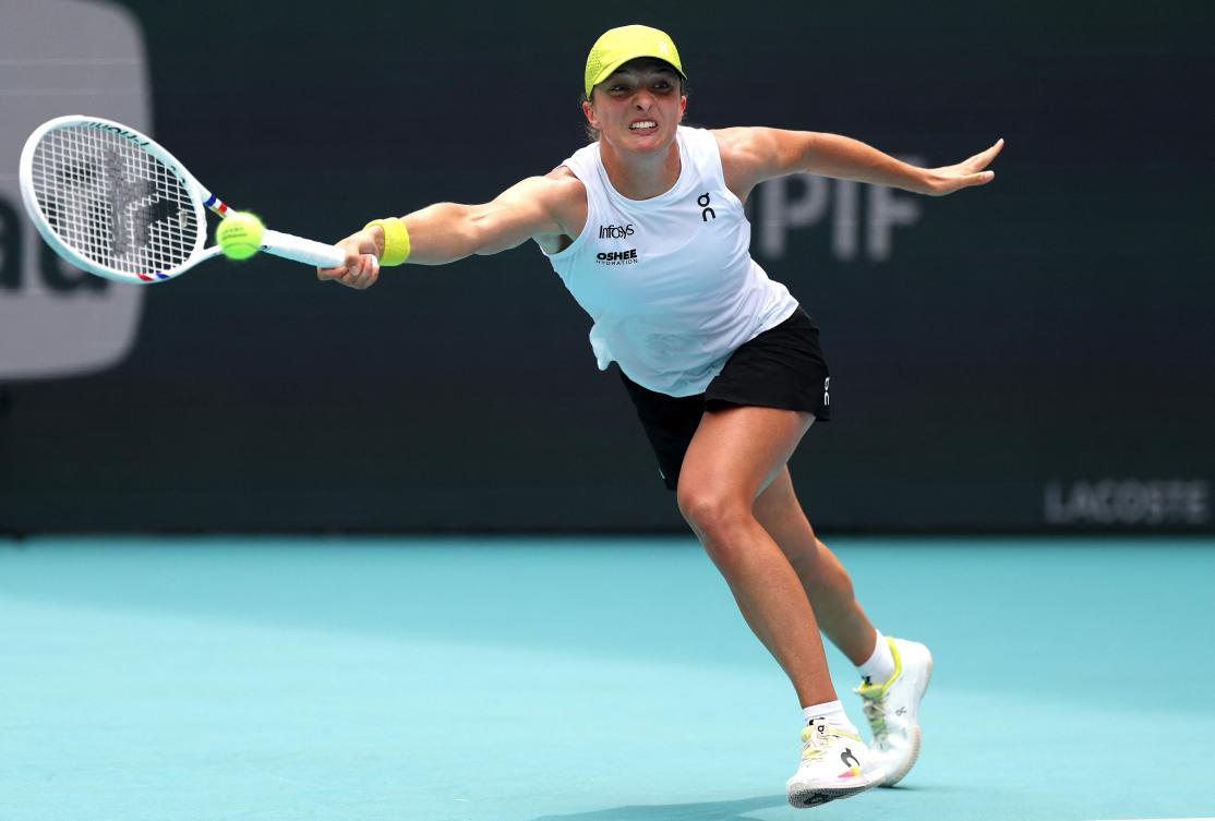 Iga Swiatek of Poland returns a shot against Elize Mertens of Belgium during Day 6 of the Miami Open at Hard Rock Stadium on Mar. 23, 2025 in Miami Gardens, Florida. (AFP)