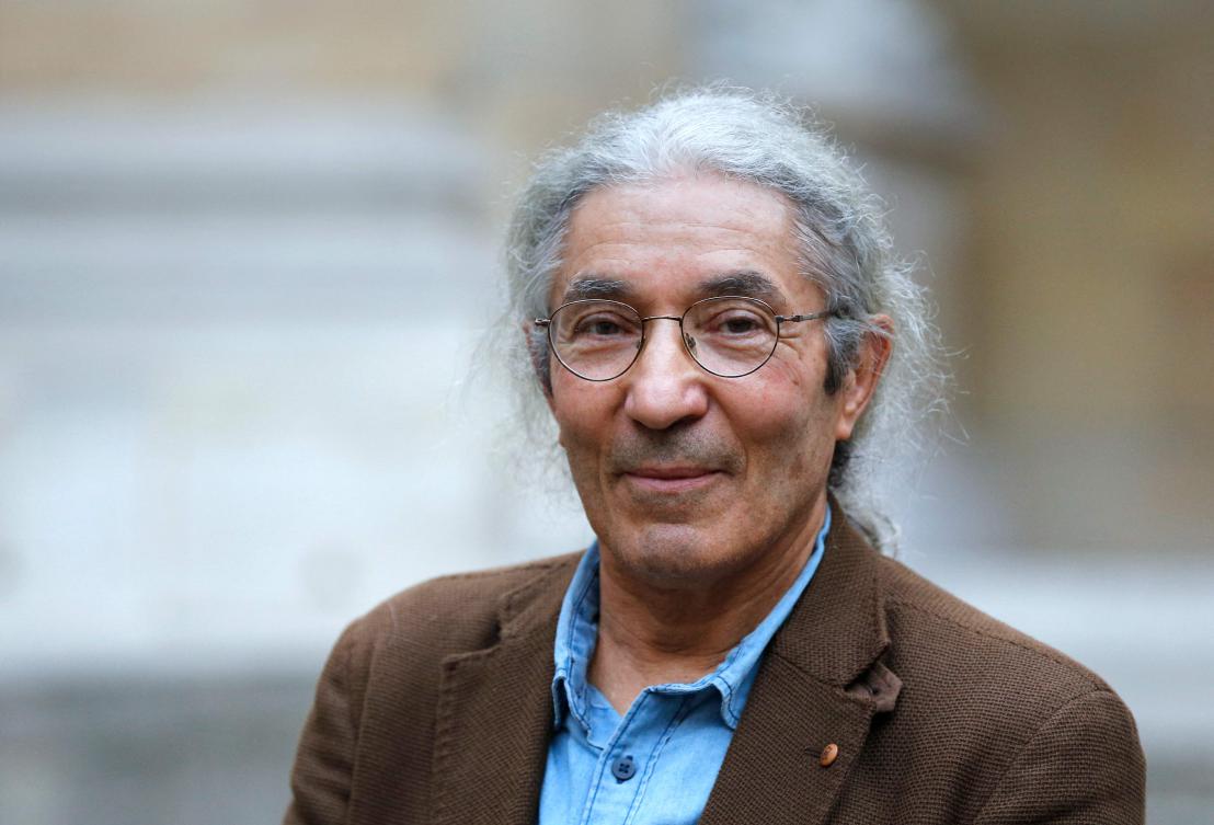 French-Algerian writer Boualem Sansal poses after being awarded, jointly with French writer Hedi Kaddour, the Grand Prix du Roman, a literary prize awarded by the Academie Francaise for an individual novel, at the Academie Francaise in Paris on October 29, 2015. (AFP)