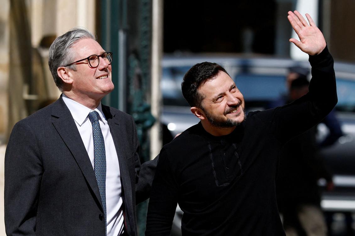 British Prime Minister Keir Starmer and Ukraine’s President Volodymyr Zelensky react after a meeting at the British embassy on the sideline of a summit for “coalition of the willing” in Paris, on Mar. 27, 2025. (AFP)