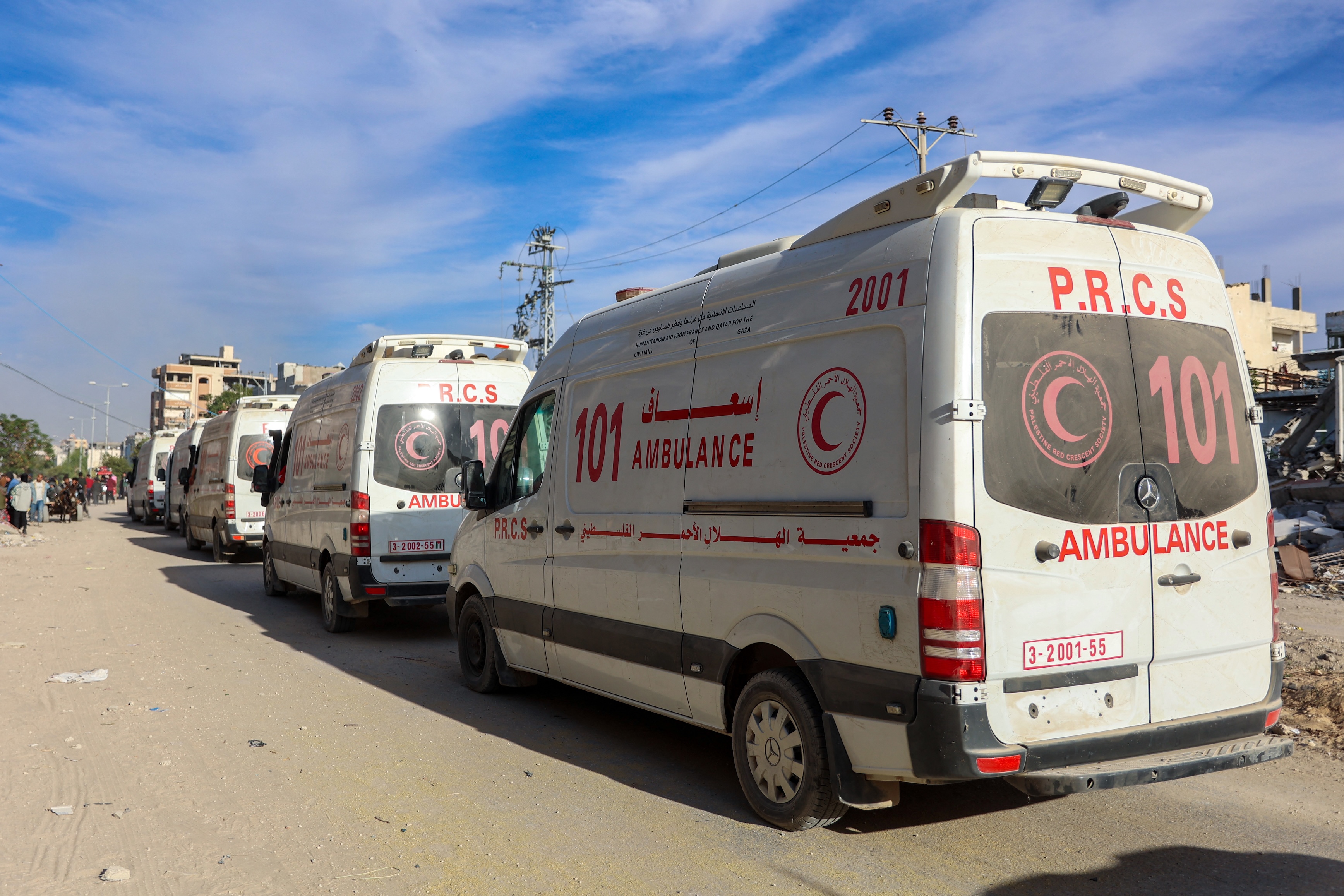 Ambulances of the Red Crescent are pictured on the main Salah al-Din road in the northern Gaza Strip, amid the ongoing war between Israel and the militant group Hamas, Nov. 17, 2024. (AFP)