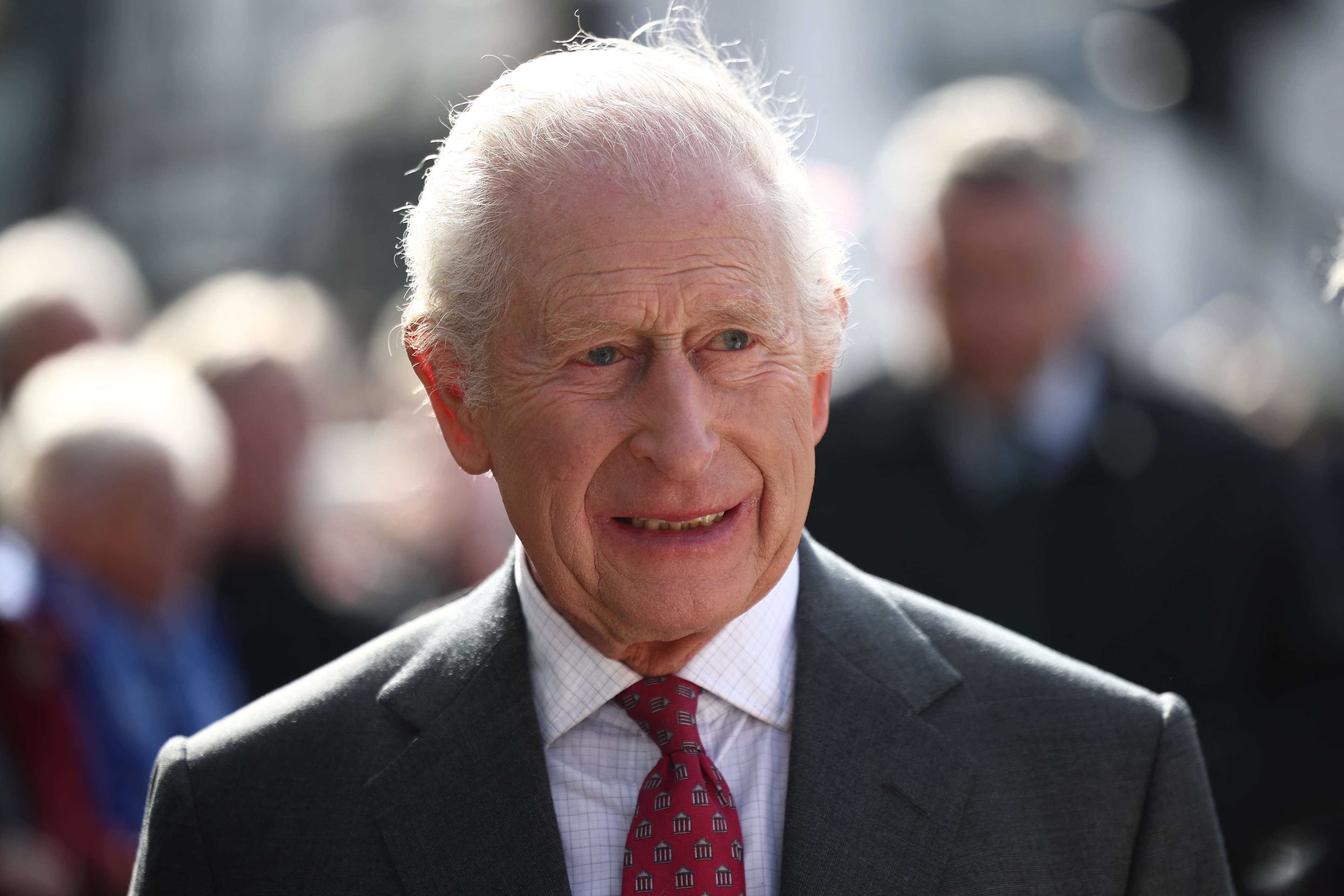 Britain's King Charles III meets well-wishers as he arrives with Britain's Queen Camilla to visit the Roe Valley Arts and Cultural Centre, in Limavady, Northern Ireland, Mar. 20, 2025. (AFP)