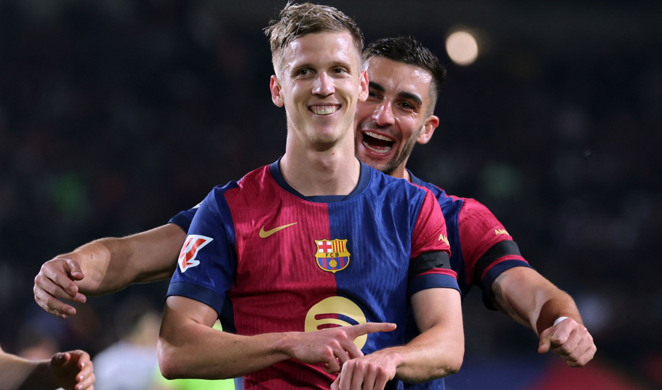 Barcelona's Spanish forward #20 Daniel Olmo (Front) celebrates with his teammate Barcelona's Spanish forward #07 Ferran Torres after scoring a penalty kick and his team's second goal during the Spanish league football match between FC Barcelona and CA Osasuna at Estadi Olimpic Lluis Companys in Barcelona on March 27, 2025. (AFP)