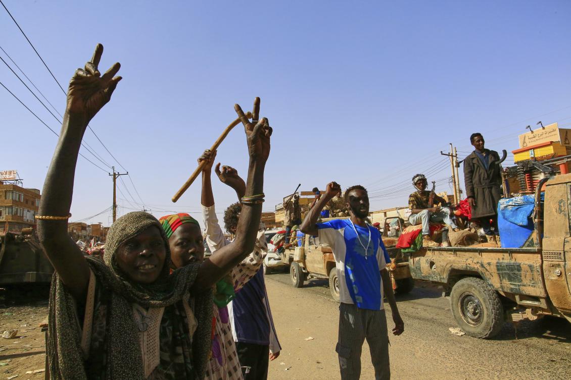 Local resident cheer as soldiers arrive to the Allafah market, in an area recently recaptured by Sudan’s army from the Rapid Support Forces paramilitary group, in the Al Kalalah district, 40km south of Khartoum, Sudan, Thursday, March 27, 2025. (AP Photo)
