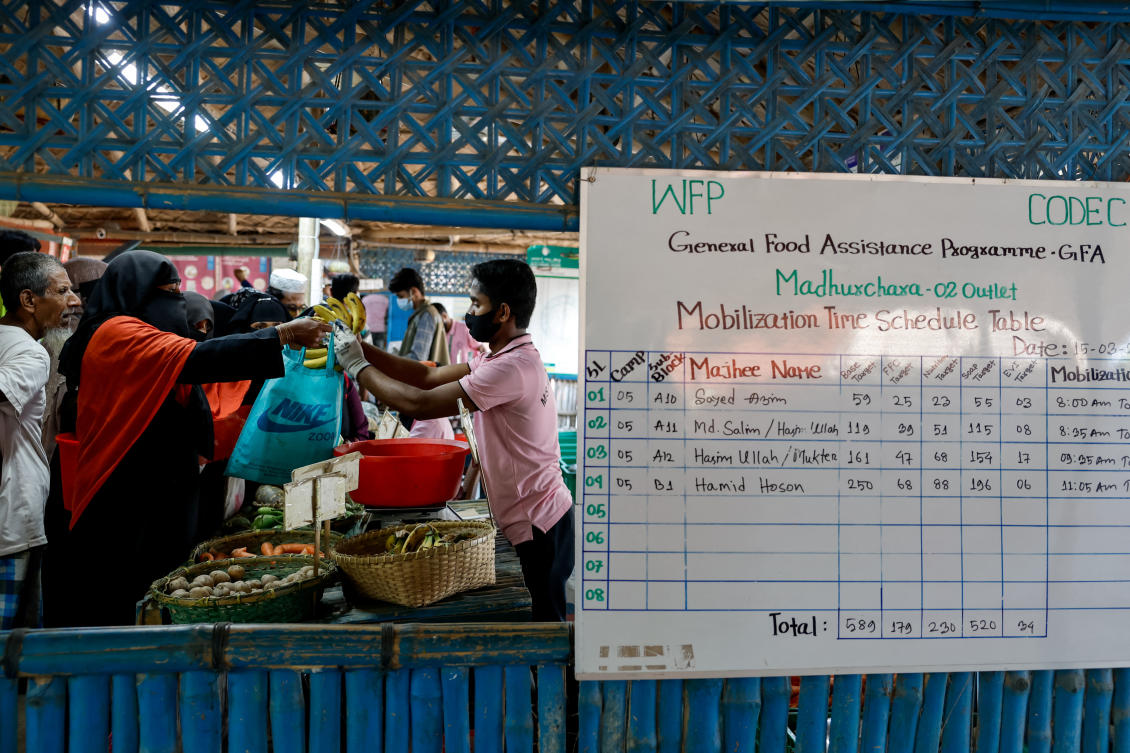 Rohingya refugees purchase vegetables and fruits from the World Food Programme distribution center at the refugee camp in Cox’s Bazar, Bangladesh on March 15, 2025. (Reuters)