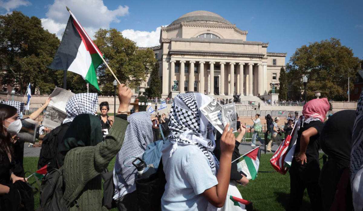 Pro-Palestinian demonstrators march through the Columbia University campus to mark one year of the war between Hamas and Israel in New York City on October 7, 2024. (AFP)
