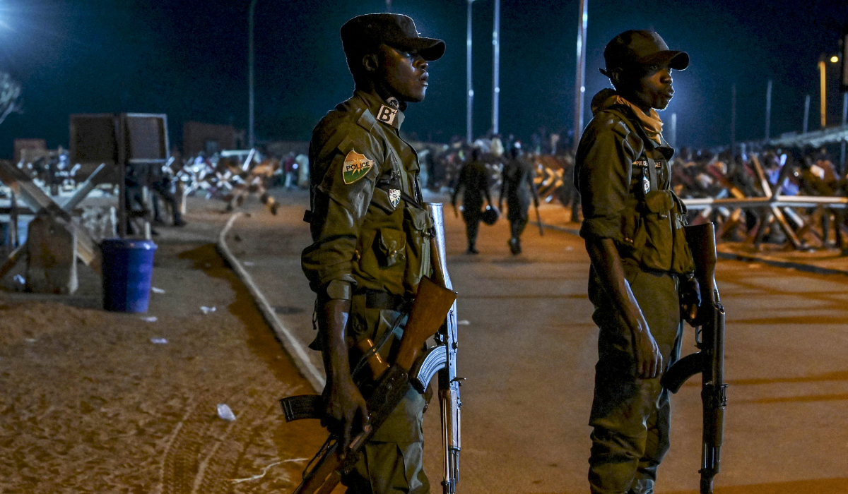 National police officers stand guard as supporters of Niger's National Council for Safeguard of the Homeland protest outside the French and Niger airbase in Niamey on September 9, 2023 to demand the departure of the French army from Niger. (AFP)