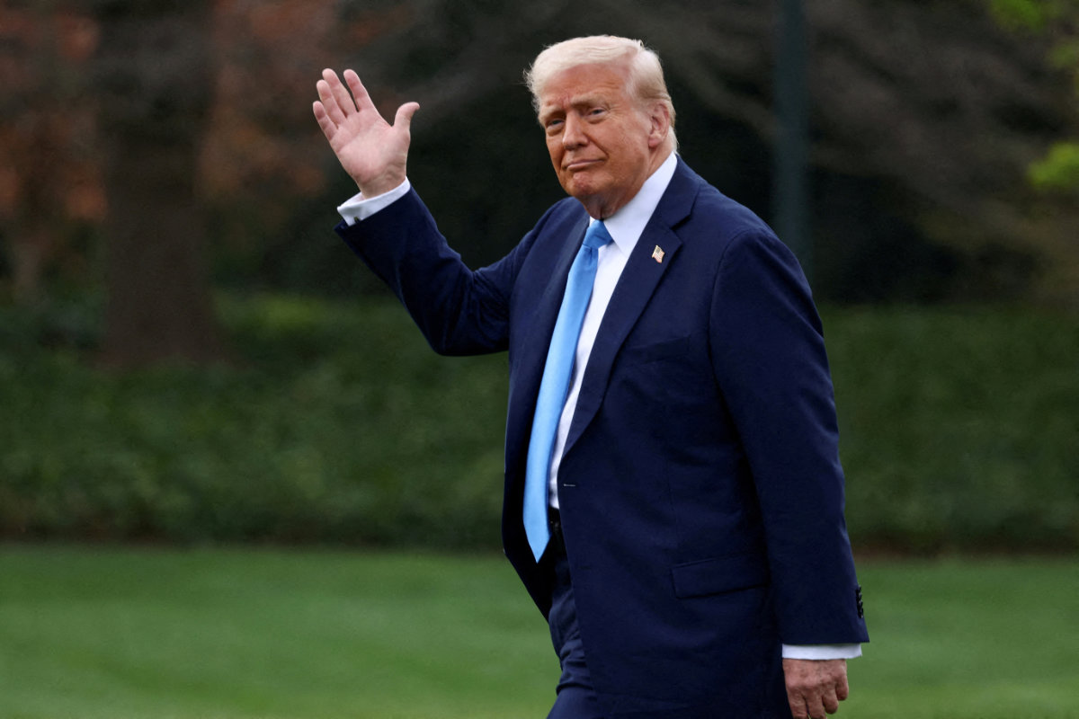 US President Donald Trump waves as he walks before departing for Florida from the South Lawn at the White House in Washington, DC, on March 28, 2025. (REUTERS)