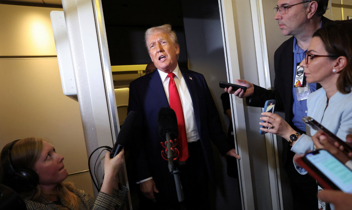 US President Donald Trump speaks to reporters aboard Air Force One on his return to Washington, DC, US, March 30, 2025. (Reuters)