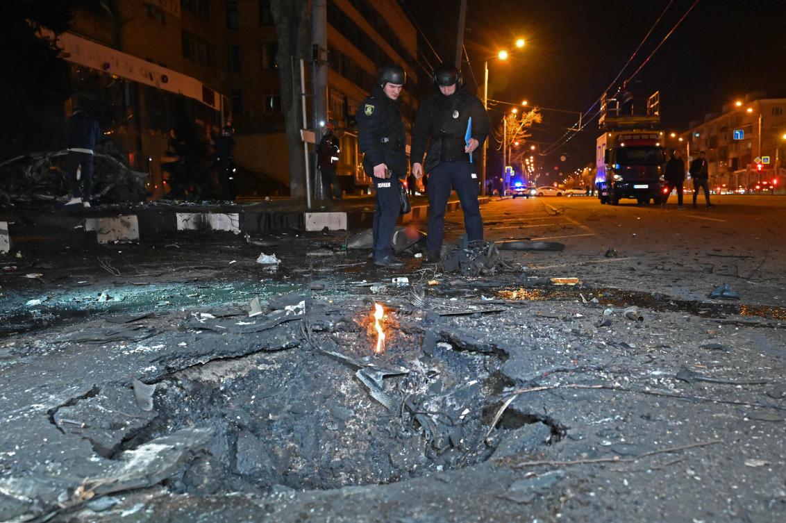 Russia bombed the city of Kharkiv in northeastern Ukraine for the second night in row. Above, Police officers stand near a crater following a drone attack in Kharkiv on March 29, 2025. (AFP)