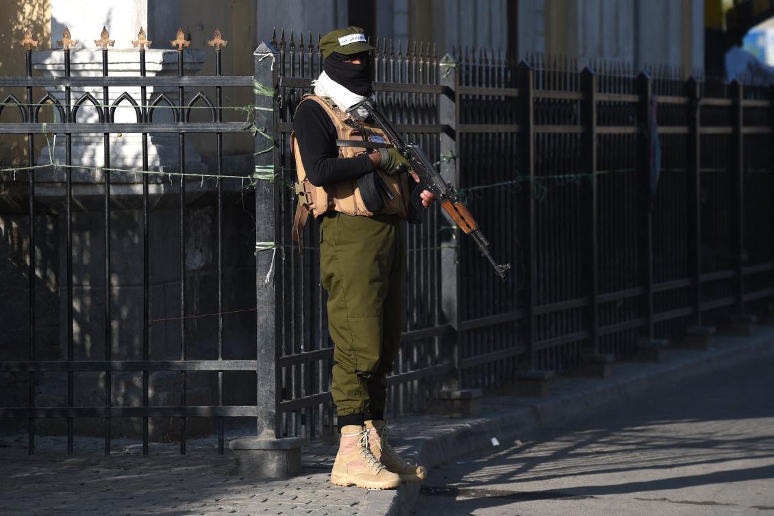 A Taliban security personnel stands guard outside the Shah-Do Shamshira Mosque during Eid Al-Fitr prayers. (AFP)