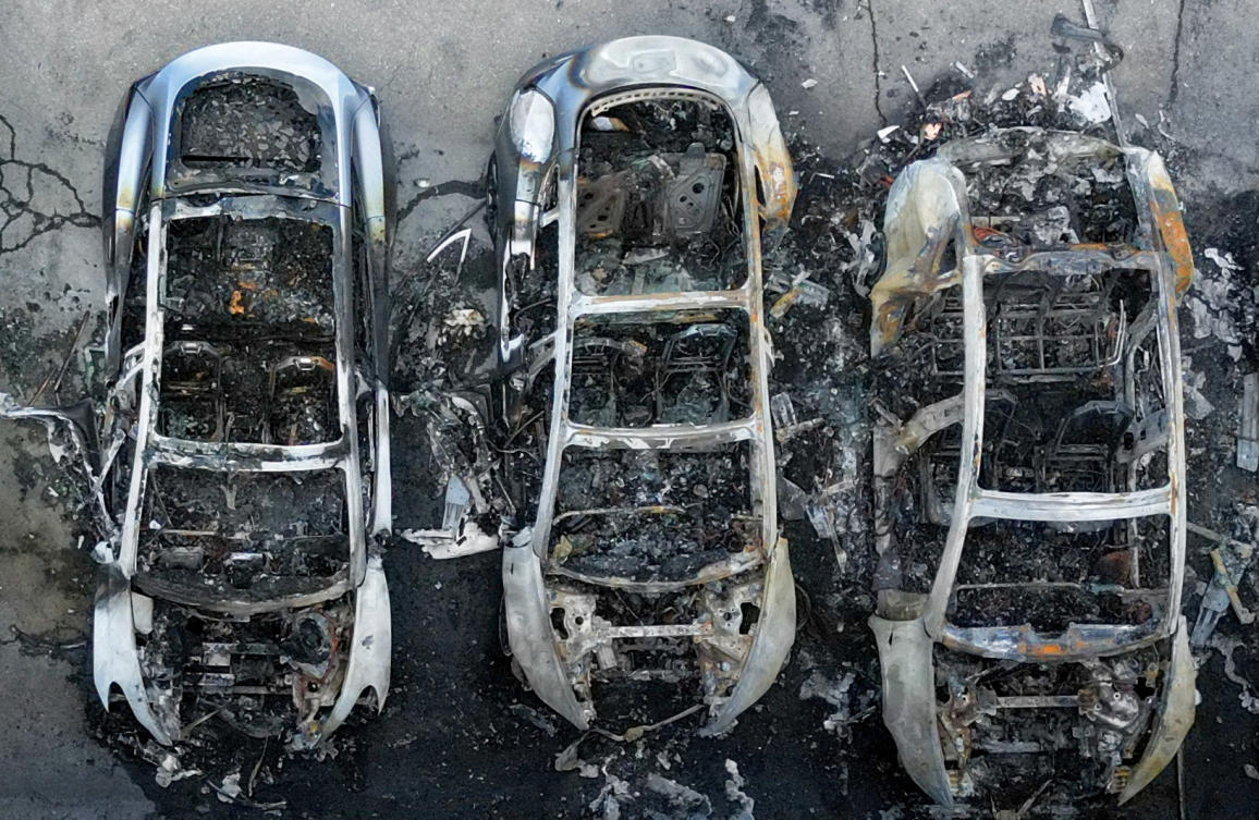 A drone view shows charred Tesla vehicles following a fire at a Tesla dealership that destroyed vehicles, in Rome, Italy, Mar. 31, 2025. (Reuters)