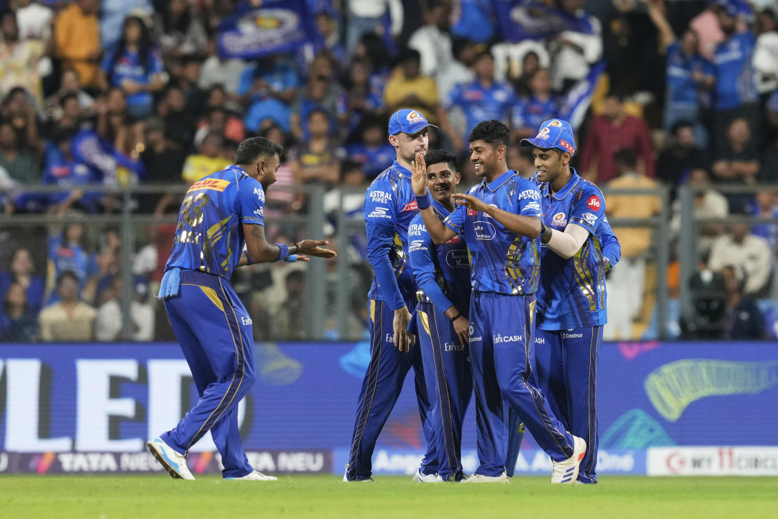 Mumbai Indians’ Ashwani Kumar, second right, and Mumbai Indians’ captain Hardik Pandya, left, celebrates the dismissal of Kolkata Knight Riders’ Andre Russell during the Indian Premier League cricket match between Kolkata Knight Riders and Mumbai Indians at Wankhede Stadium in Mumbai, India, Monday, March 31, 2025. (AP)