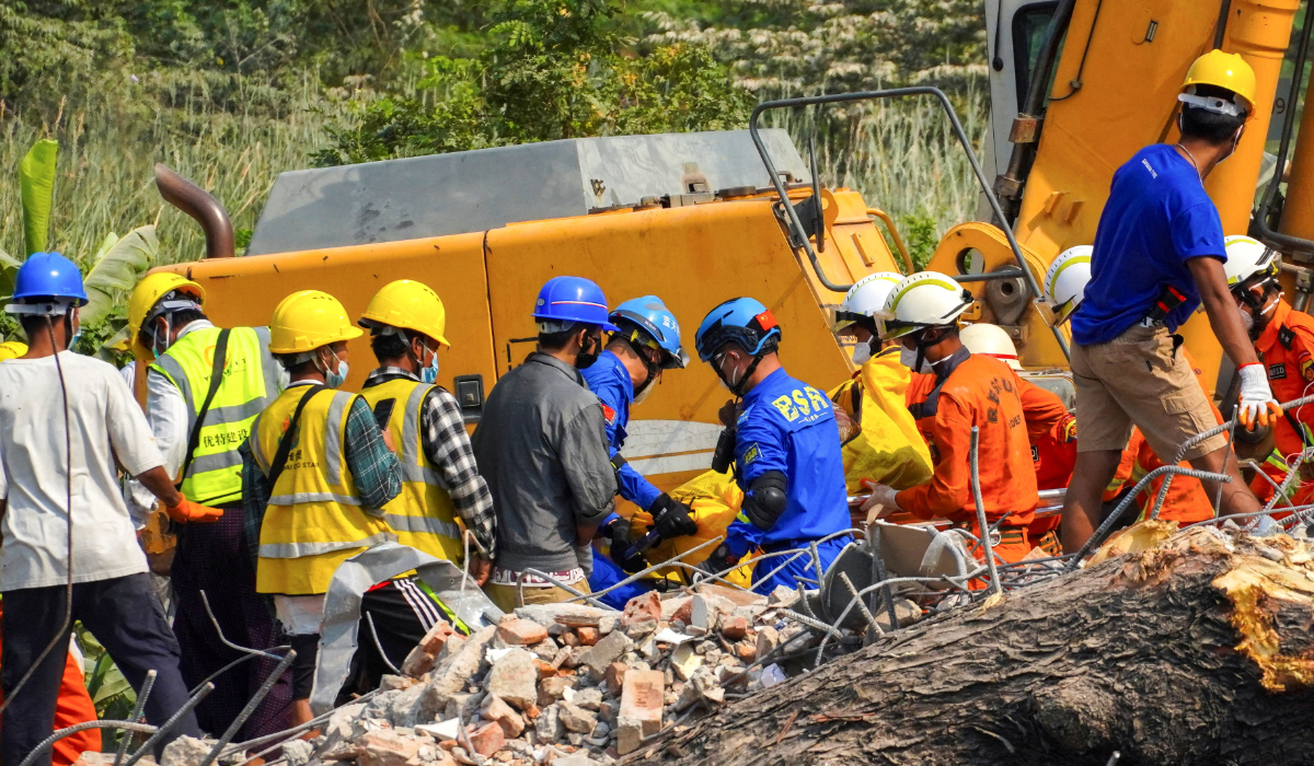 Rescue workers carry a body of a victim, in the aftermath of a strong earthquake, in Mandalay, Myanmar, March 31, 2025. (REUTERS)