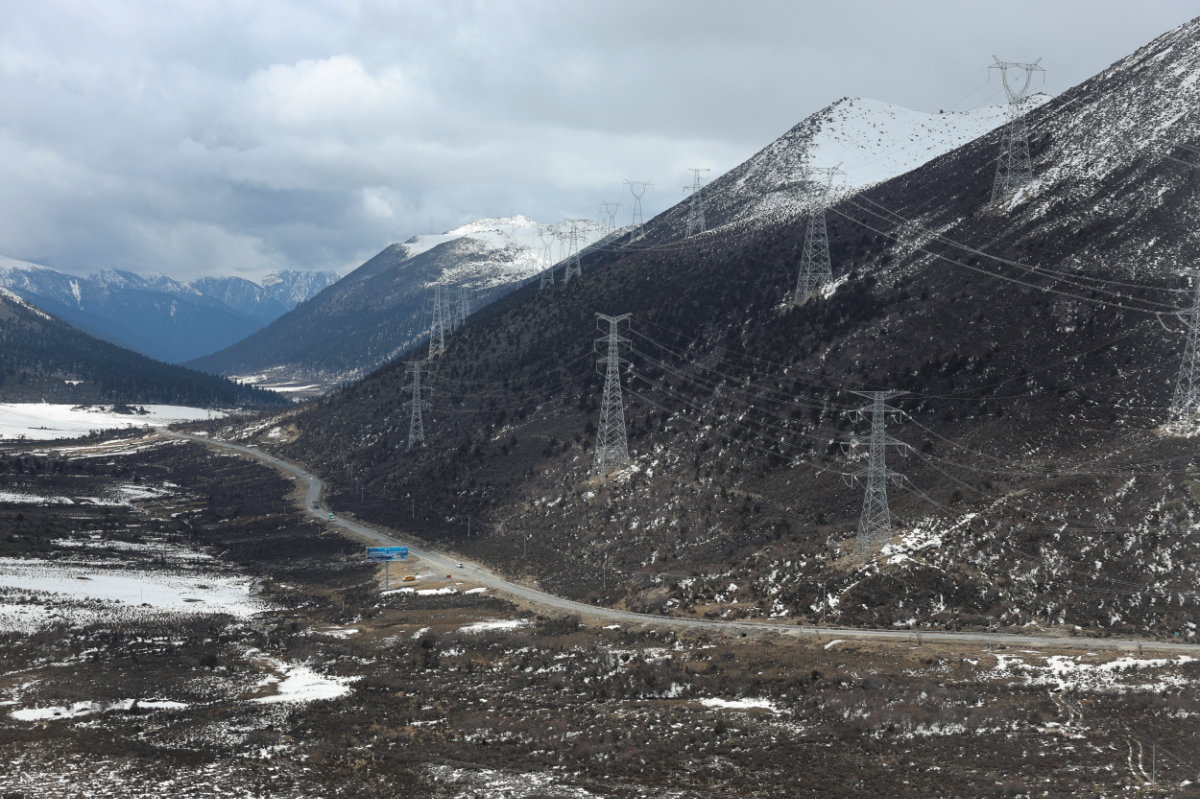Transmission towers on mountains are pictured, during a government-organized tour, near Nyingchi, Tibet, on March 31, 2025. (REUTERS)