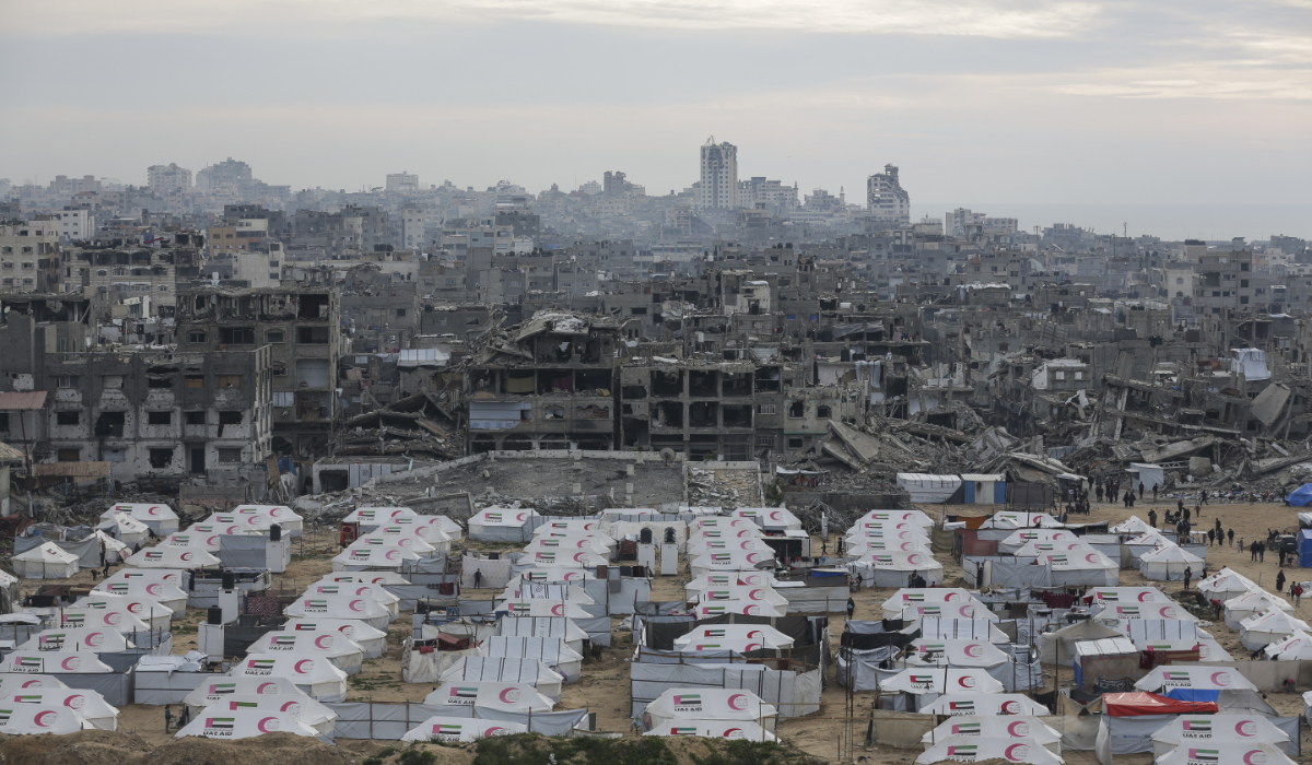 A tent camp for displaced Palestinians is set up amid destroyed buildings in Gaza. (AP)