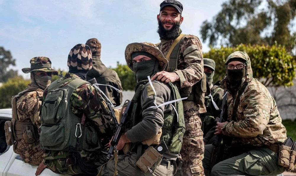 Security forces loyal to the interim Syrian government in Latakia, Mar. 9, 2025. (AFP)
