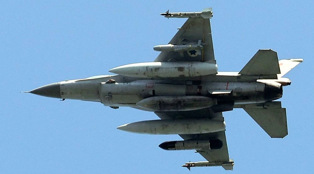 An Israeli Air Force F-16 fighter aircraft flies over the city of Yokneam Illit in northern Israel on March 24, 2025. (AFP)