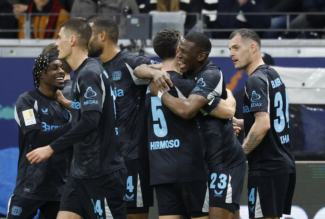 Bayer Leverkusen’s Nordi Mukiele celebrates scoring their second goal with teammates during their Bundesliga match against Eintracht Frankfurt at Deutsche Bank Park, Frankfurt, Mar. 1, 2025. (Reuters)