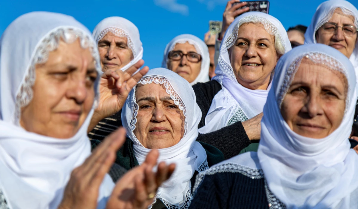 Kurdish women gather to watch live on a tv screen a Pro-Kurdish Peoples' Equality and Democracy Party, or DEM, delegation members releasing an statement from the jailed leader of the rebel Kurdistan Workers' Party, or PKK, Abdullah Ocalan, in Diyarbakir, Turkey, Thursday, Feb. 27, 2025. (AP)