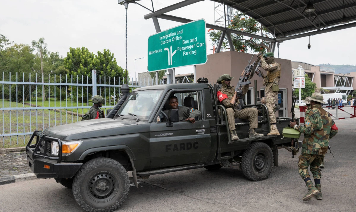 M23 rebels during the escort of captured FDLR members to Rwanda for repatriation, at the Goma-Gisenyi Grande Barrier border crossing. (Reuters)