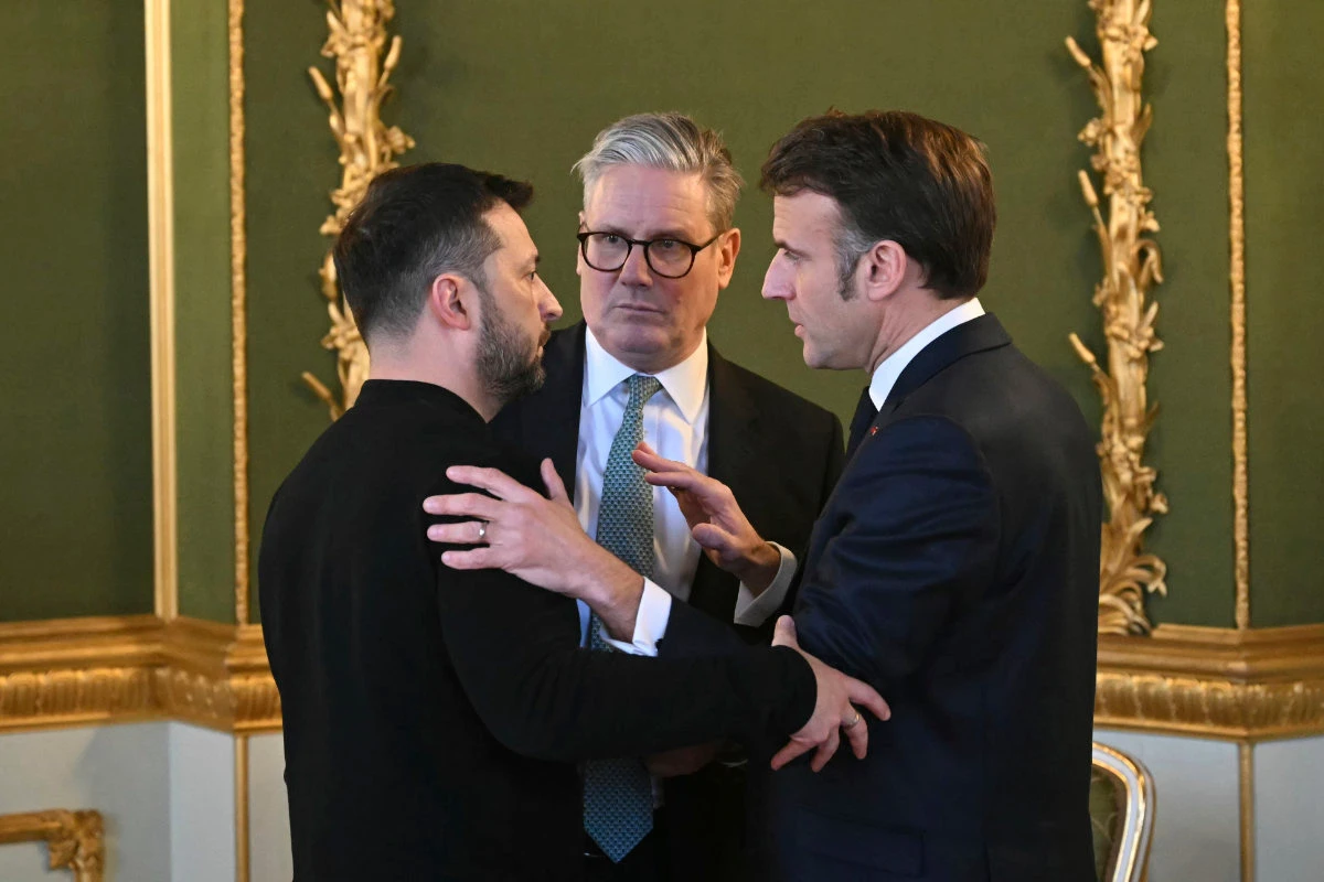 Britain's Prime Minister Keir Starmer, center, Ukraine's President Volodymyr Zelenskyy, left, and France's President Emmanuel Macron meet during the European leaders' summit to discuss Ukraine at Lancaster House, London, on March 2, 2025. (Pool via AP)