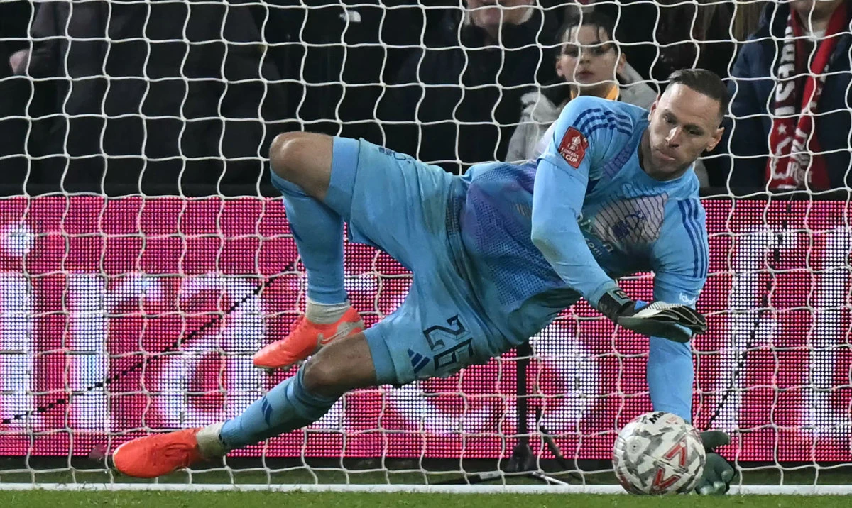 Nottingham Forest’s Belgian goalkeeper Matz Sels saves a penalty from Ipswich Town’s Irish midfielder Jack Taylor to win the penalty shootout during the sides' English FA Cup fifth round football match at The City Ground in Nottingham, central England, on March 3, 2025. (AFP)