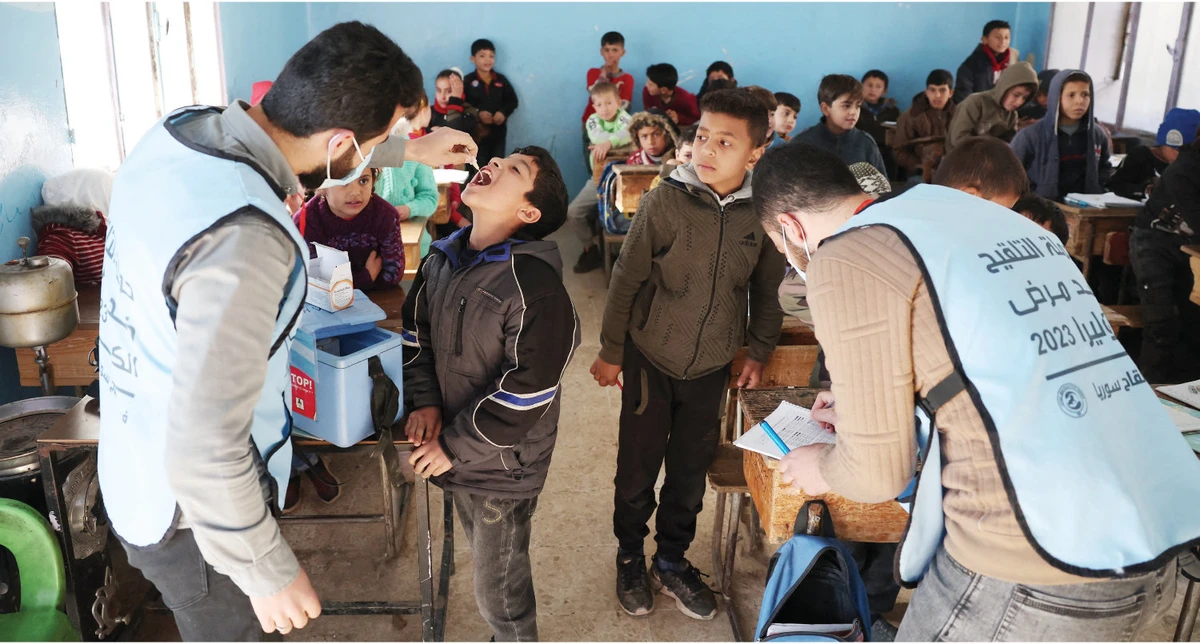 Medics give cholera vaccination to children in the town of Maaret Misrin in the rebel-held northern part Idlib province in Syria on March 7, 2023. (AFP/file)