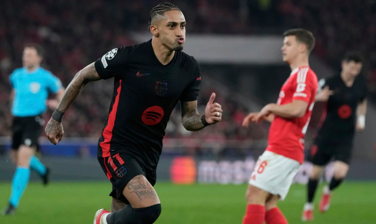 Barcelona's Raphinha celebrates after scoring his side's opening goal during the Champions League round of 16 first leg soccer match between SL Benfica and FC Barcelona at the Luz stadium in Lisbon, Wednesday, March 5, 2025. (AP)