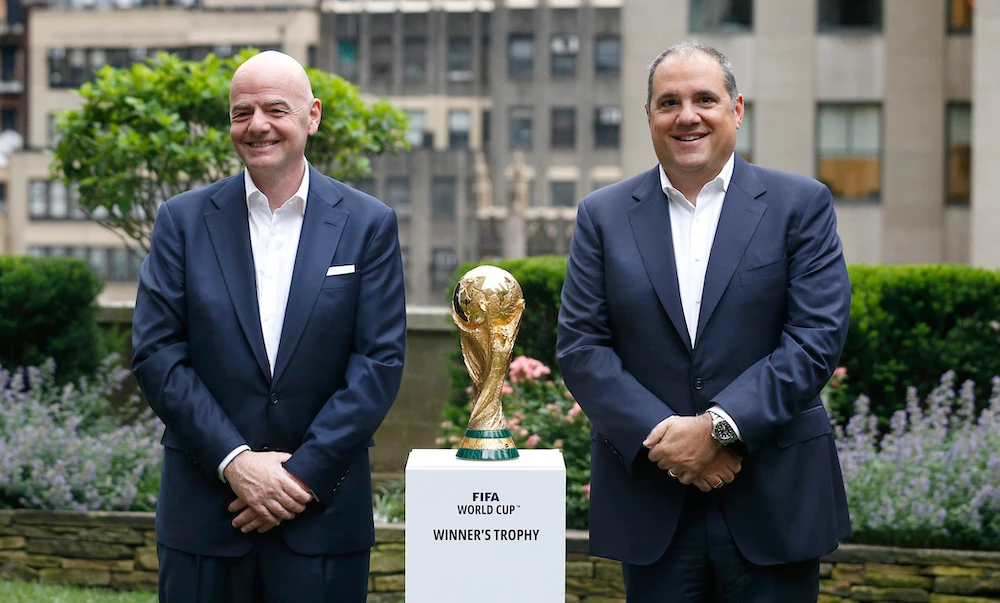FFIFA President Gianni Infantino, left, and FIFA Vice President Vittorio Montagliani stand with the World Cup trophy on June 16, 2022 in New York. (AP file photo)