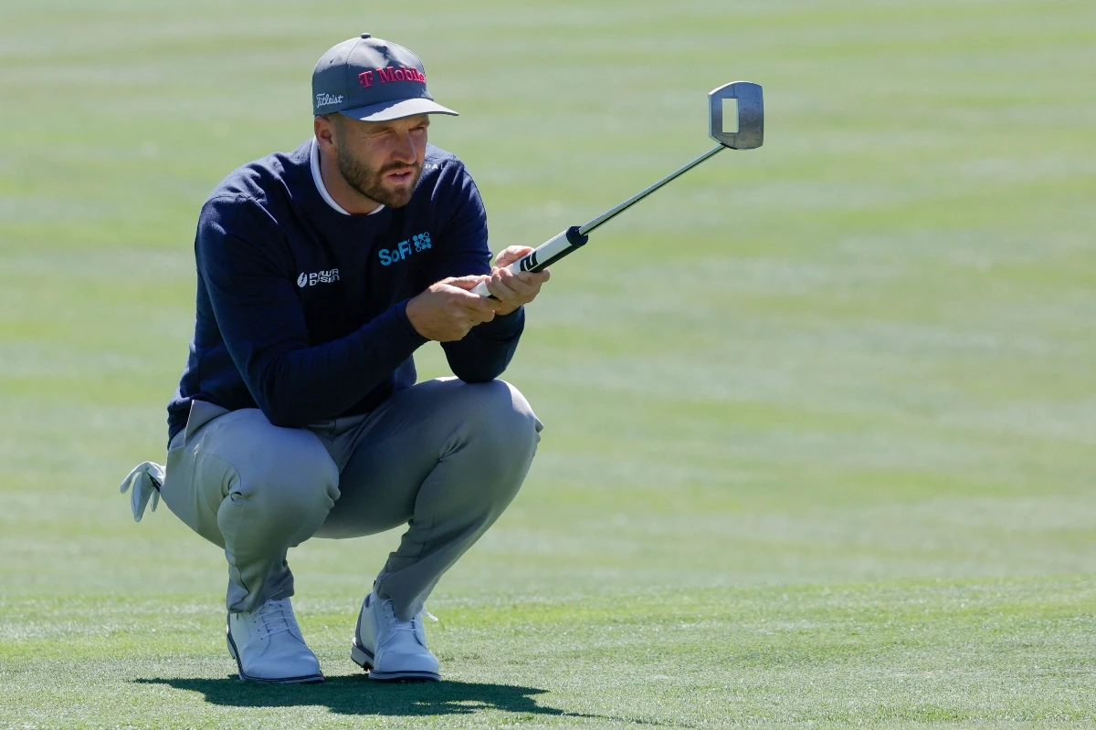 Wyndham Clark lines up a putt on the second green during the first round of the Arnold Palmer Invitational golf tournament at Bay Hill Thursday. (Reinhold Matay-Imagn Images)