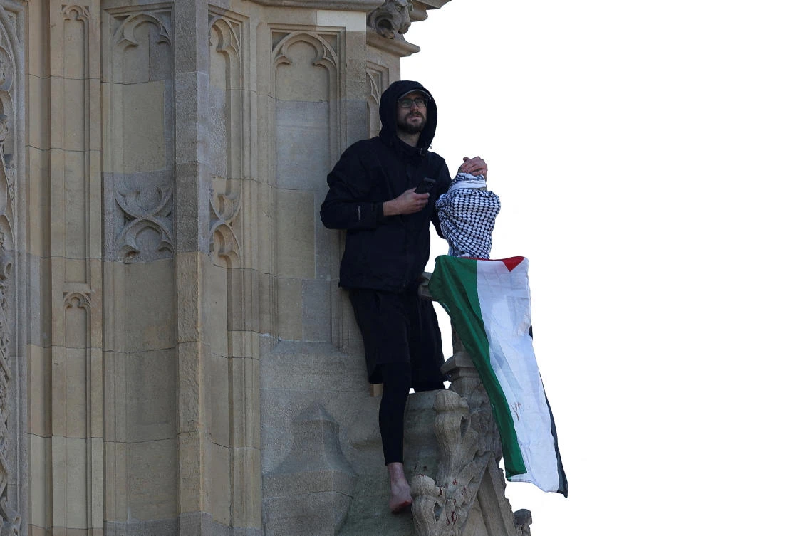 Man with Palestinian flag scales Big Ben in London