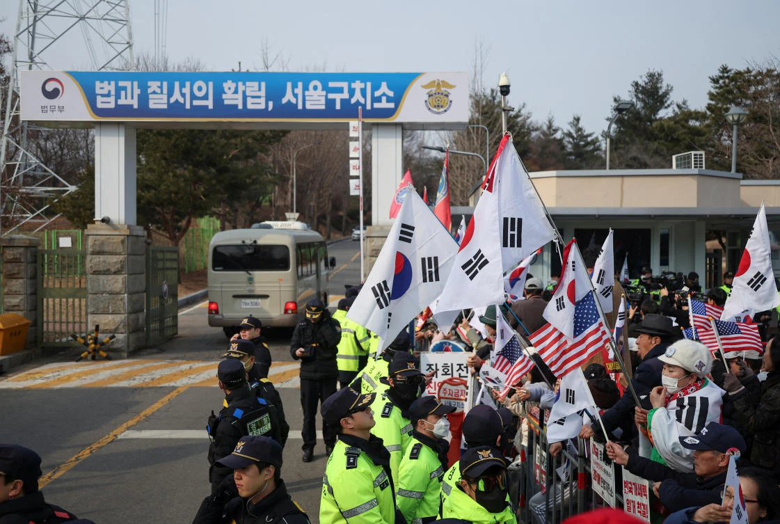 South Korea’s President Yoon free, trials continue after court quashes detention