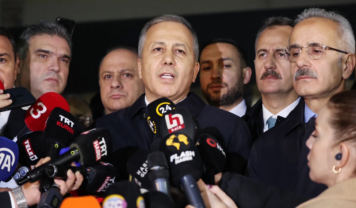 Turkish Interior Minister Ali Yerlikaya (C) speaks to the media in Ankara. (AFP)