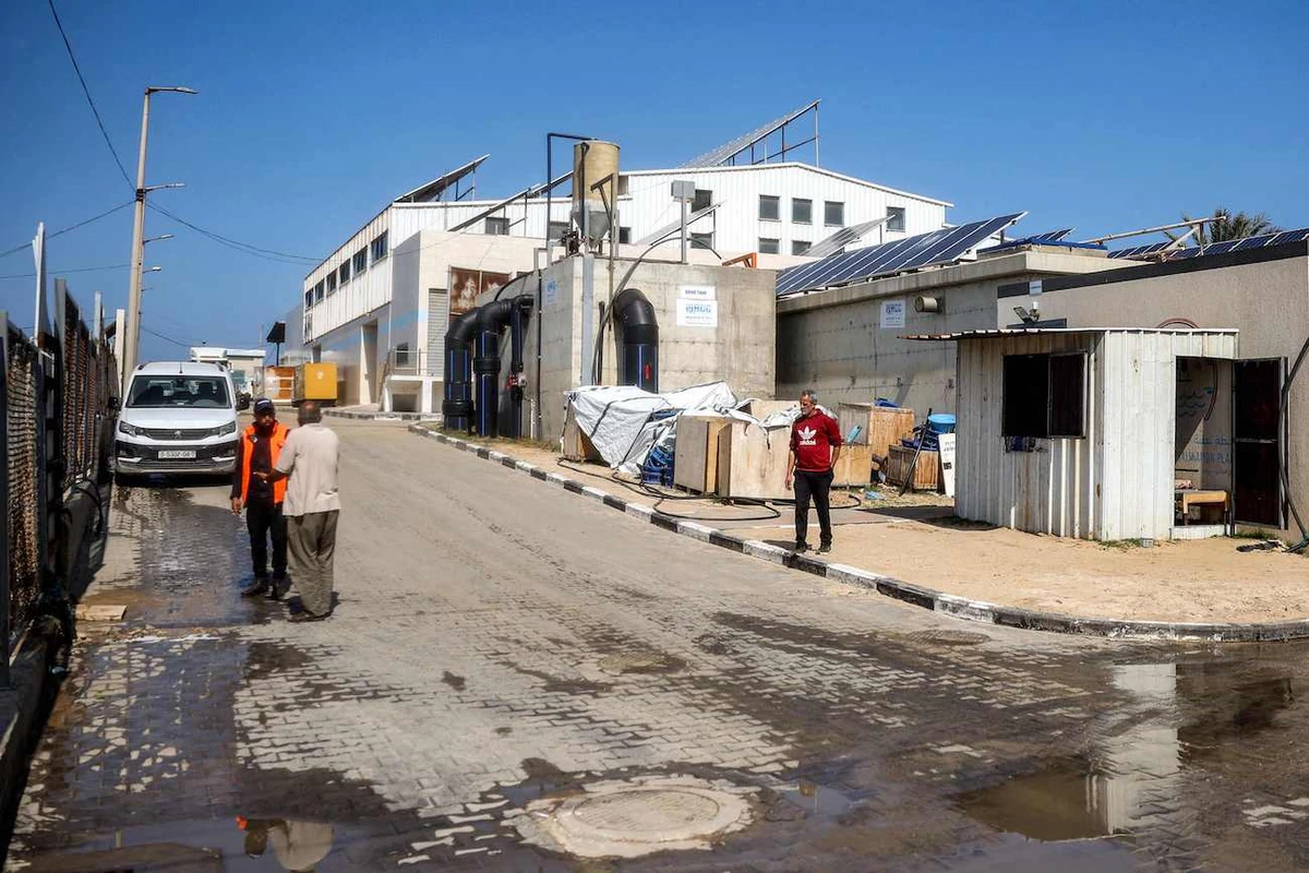 A man walks outside Southern Gaza Desalination plant, which stopped working earlier after Israel cut off electricity supply to Gaza Strip, in Deir El-Balah, on March 10, 2025. (AFP)