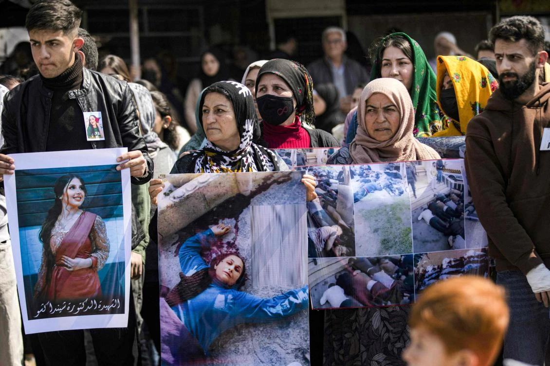 People gather for a mass demonstration in Syria's northeastern city of Qamishli on March 11, 2025 protesting against a recent wave of sectarian violence targeting Syria's Alawite minority in the west of the country along the Mediterranean sea coast. (AFP)