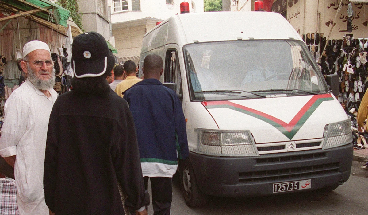 A police car patrol the streets of the Souk Dakhel 24 July 2000 in Tangier. (AFP)