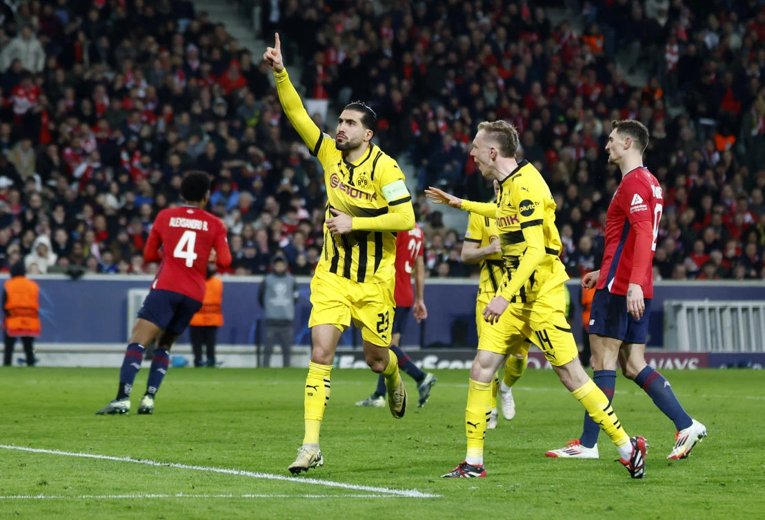 Borussia Dortmund’s Emre Can celebrates scoring their first goal with Maximilian Beier during their Champions League — Round of 16 — Second Leg — match against Lille at Decathlon Arena Stade Pierre-Mauroy, Villeneuve-d’Ascq, France — Mar. 12, 2025. (Reuters)
