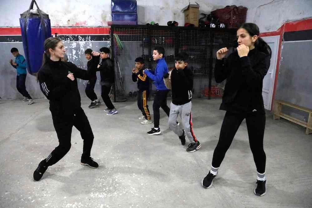 Algerian junior boxing champion for 2025 Cerine Kessal, right, practices with trainer Manal Berkach, a former boxer herself, at a club in Azazga town in Algeria’s Tizi Ouzou province on Feb. 25, 2025. (AFP)