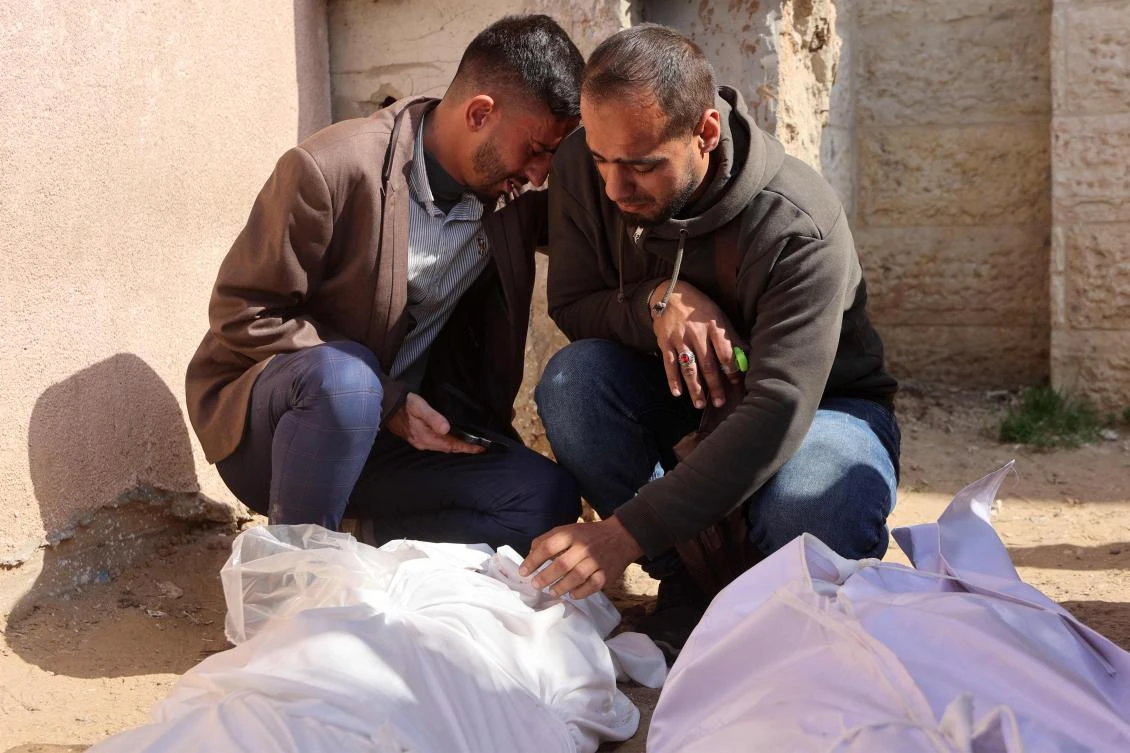 Mourners gather by the shrouded bodies of victims killed by Israeli bombardment in Beit Lahia in the northern Gaza Strip, outside the Indonesian hospital in Beit Lahia on March 15, 2025. (AFP)
