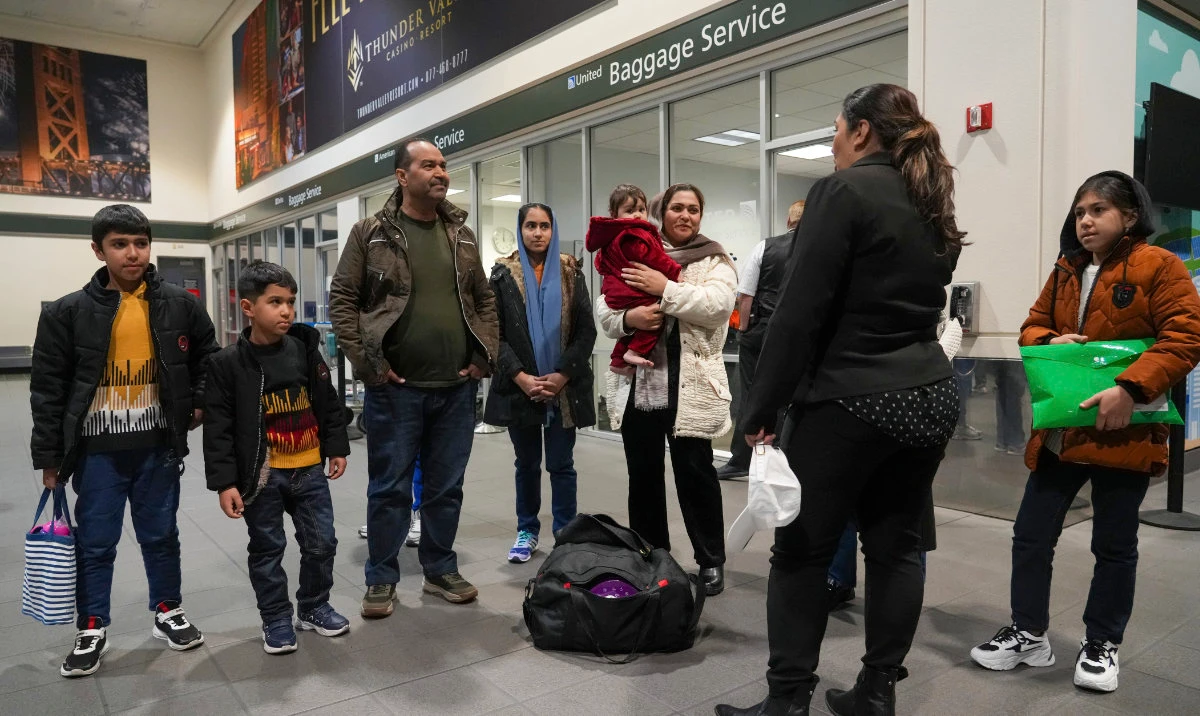 After leaving Afghanistan two-months earlier, Mohammad Saboor Osmani, third from left, and his family are greeted by a representative of No One left Behind Organization after their arrival at the Sacramento International Airport in Sacramento, Calif., Tuesday, March 11, 2025. (AP)