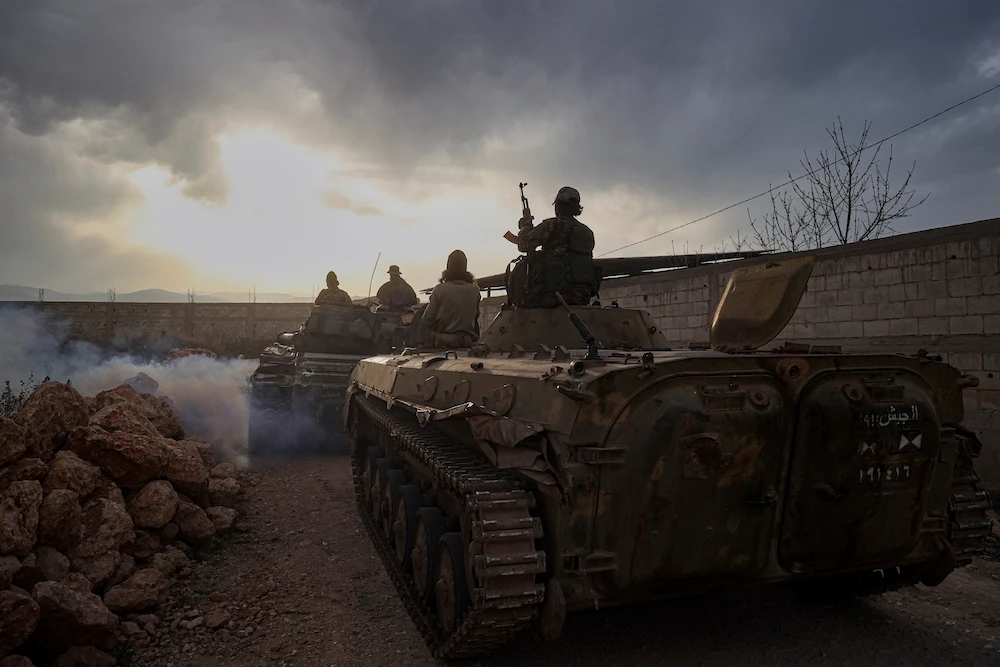 Syrian troops maneuver in the village of Hawsh al-Sayyid Ali, located 2 km (1.24 miles) from the Lebanon border, Syria, Monday, March 17, 2025. Lebanon's president ordered troops to retaliate for gunfire from the Syrian side of the border after renewed fighting broke out overnight along the frontier. (AP)