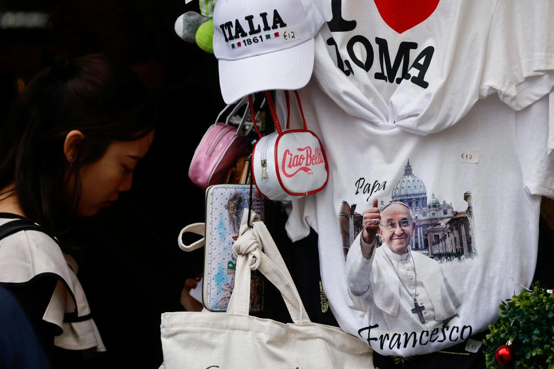 Italian and pope-themed items are displayed in a gift shop as Pope Francis continues treatment at Gemelli hospital in Rome, Italy . (REUTERS)