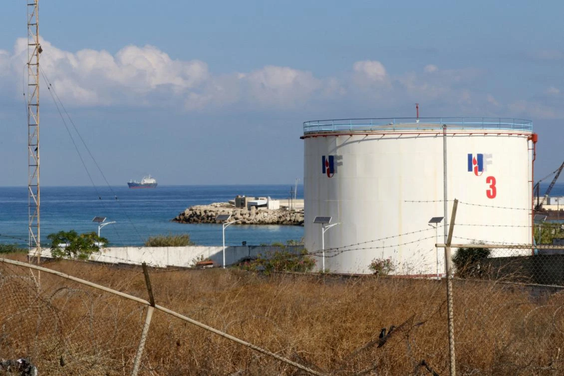 An oil tanker carrying fuel oil from Iraq, is seen anchored near the Zahrani power plant in Zahrani near the southern Lebanese city of Sidon (Saida) on September 18, 2021. (AFP)