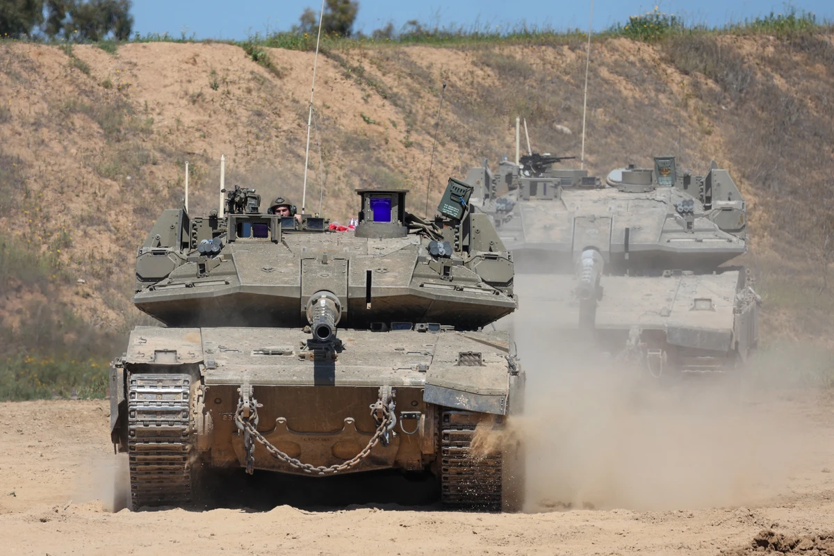 An Israeli soldier operates a tank at a position along Israel's southern border with the northern Gaza Strip, Mar. 19, 2025. (AFP)