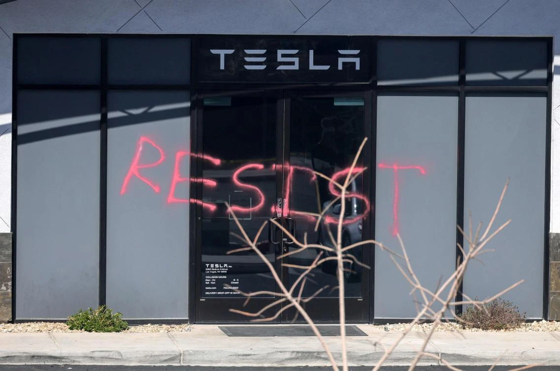 Several Tesla dealerships around the country have been vandalized in recent weeks and the company’s stock price has plummeted over the past month. (Getty Images North America/AFP)