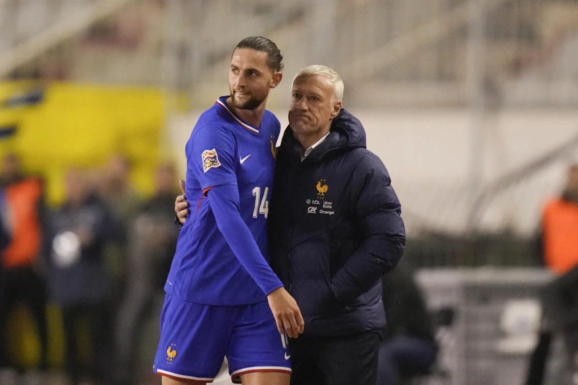 France’s coach Didier Deschamps hugs Adrien Rabiot as he leaves the pitch after being substituted during their UEFA Nations League quarterfinal match against Croatia, at the Poljud stadium in Split, Mar. 20, 2025. (AP)